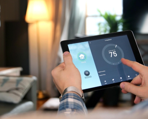 Close-up of a smart tablet interface that is controlling a smart thermostat remotely